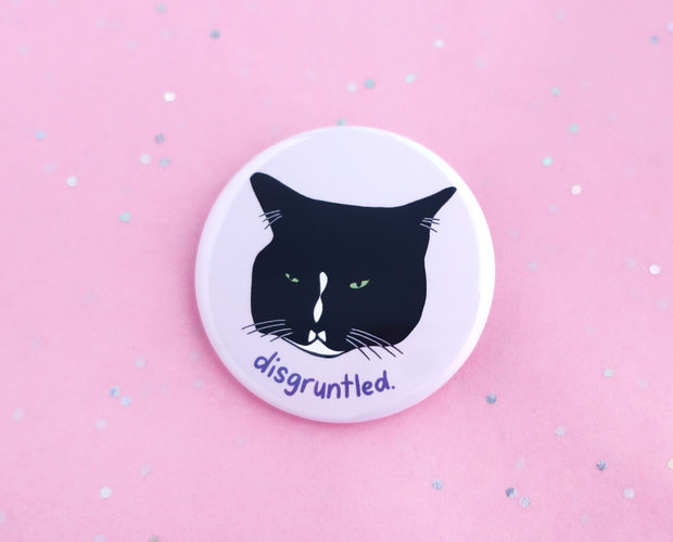 Disgruntled tuxedo cat button